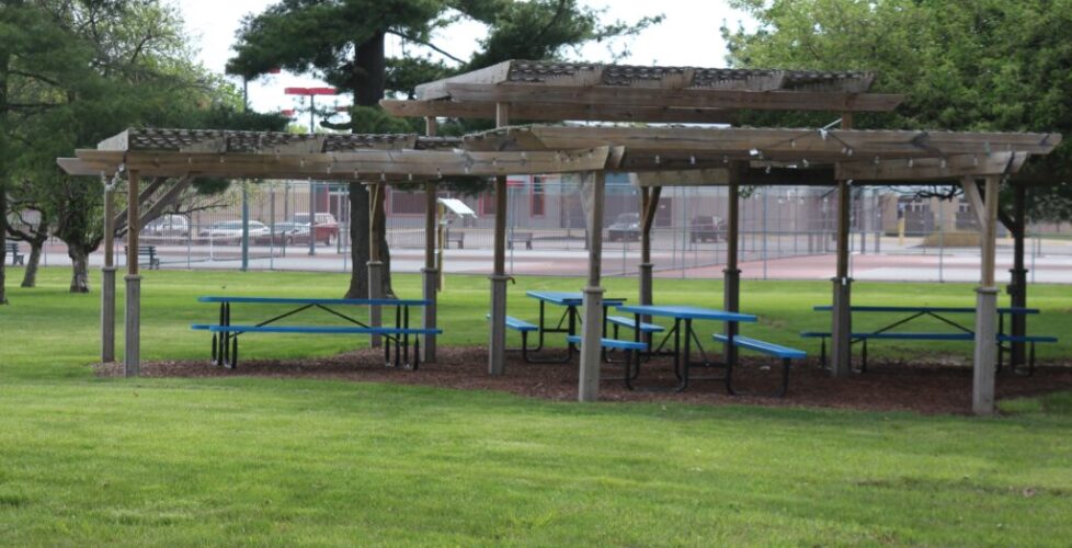 Photograph of our Sukkah with tables inside.