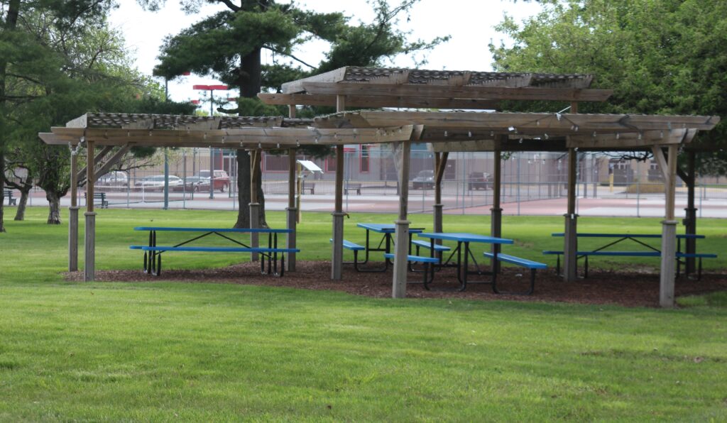 Photograph of our Sukkah with tables inside.