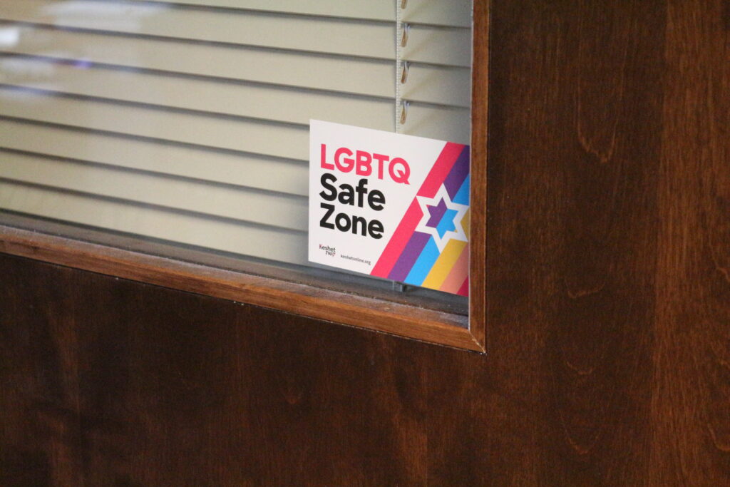 Decorative photo of the Rabbi's office door with a sticker that says "LGBTQ Safe Zone"