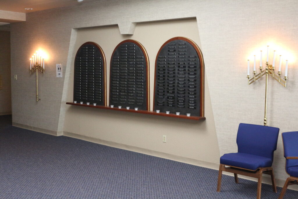 Decorative photograph of the Yarhzeit Memorial Wall inside the Temple entry.