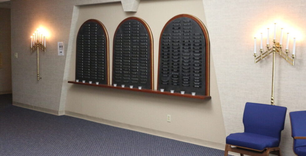 Photograph of yahrzeit memorial wall outside of the sanctuary.